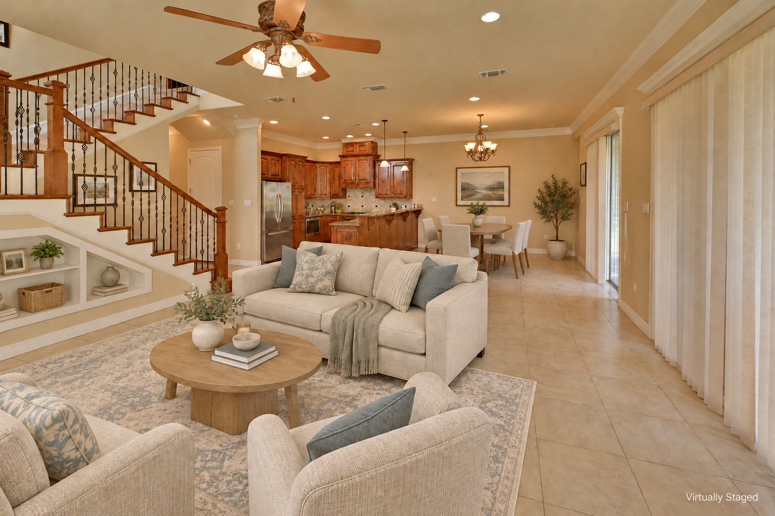 Same living room after virtual staging with revised seating, rug, and decor